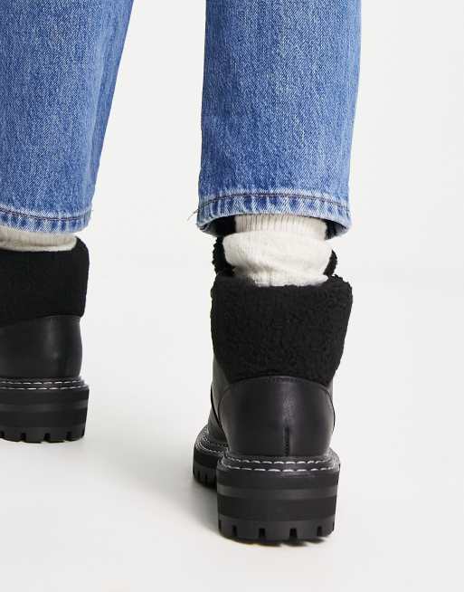 Black boots with 2025 white fur trim