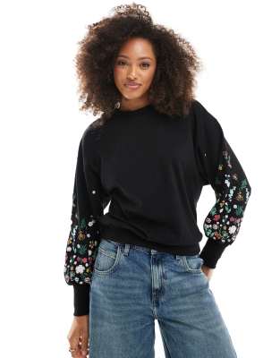 crew neck sweater with floral sleeve detail in black