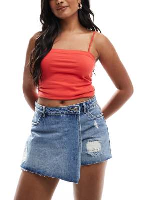 distressed denim skort in midwash blue