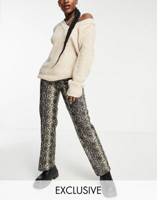 Only exclusive faux leather wide leg trousers in snake print
