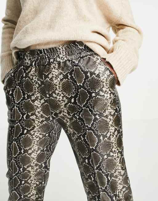 Only exclusive faux leather wide leg trousers in snake print