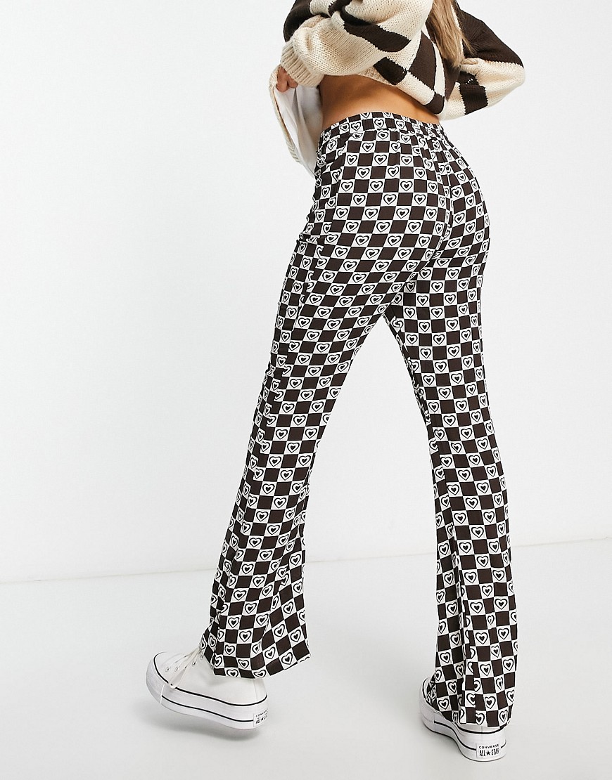 Only flared trousers in brown heart print
