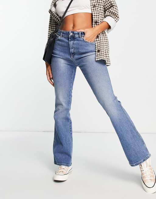 ASOS DESIGN low rise flared jeans with western pocket detail in