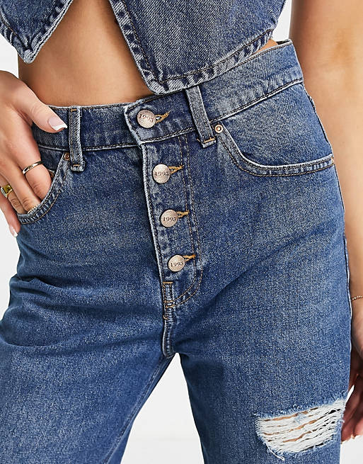  Only Hope wide leg jean with exposed buttons and extreme rips in mid blue wash 