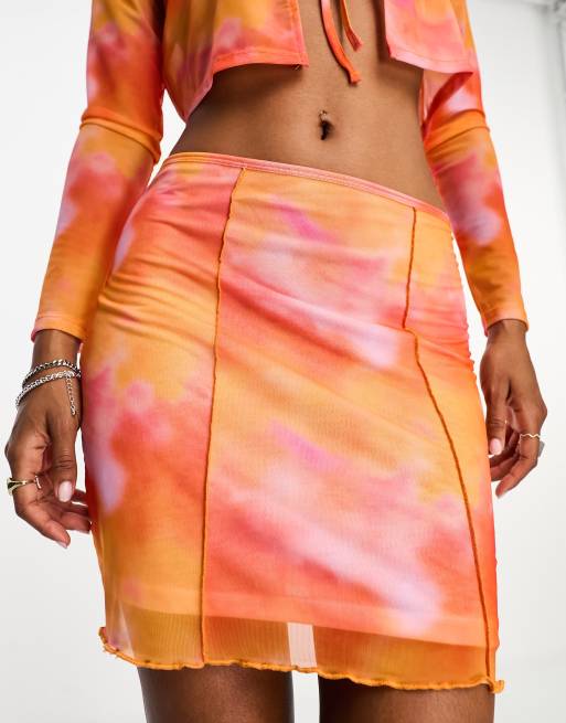 Only mesh mini skirt in orange tie dye part of a set