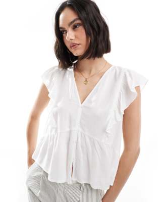 ruffle detail button through top in white