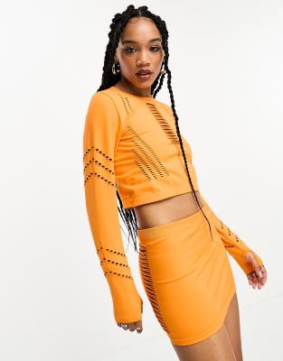 seamless cut out mini skirt in orange - part of a set