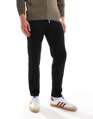 slim tapered fit pants in black