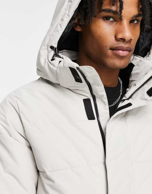 Waterproof puffer with store hood