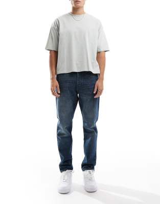 Yoke tapered fit jeans in dark blue wash