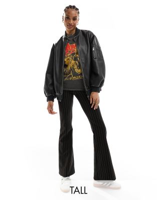 ONLY Tall flared trousers in black pinstripe