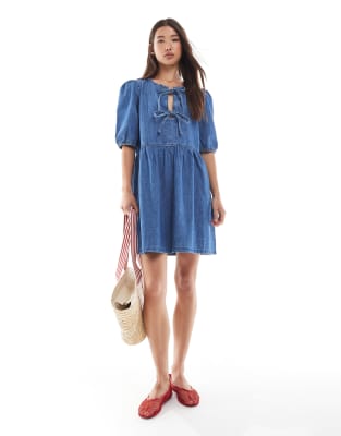 tie front puff sleeve denim mini dress in mid blue