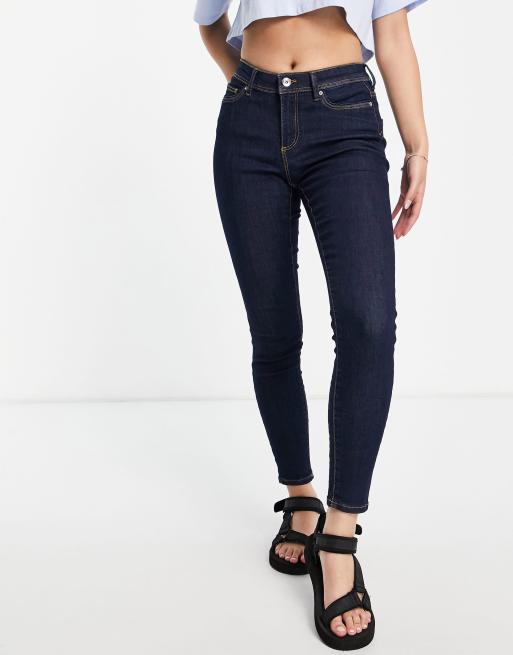 Only Wauw mid rise skinny jeans in dark blue | ASOS