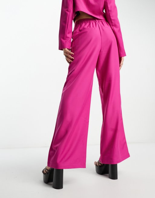 Only high waisted flared pants in bright pink (part of a set)