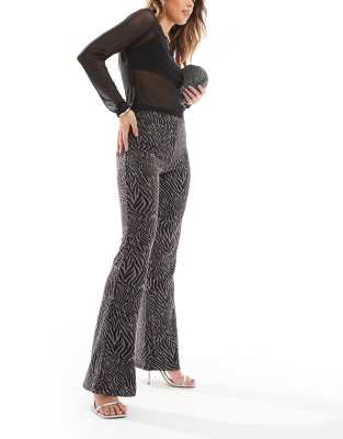 zebra print glitter flare pants in black