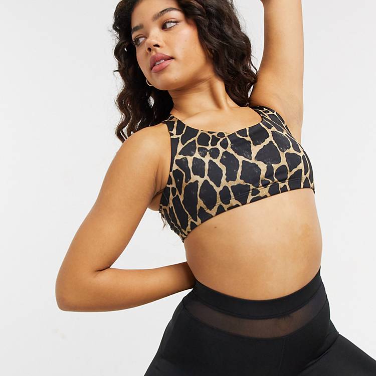 Onzie Chic medium support yoga sports bra in black giraffe