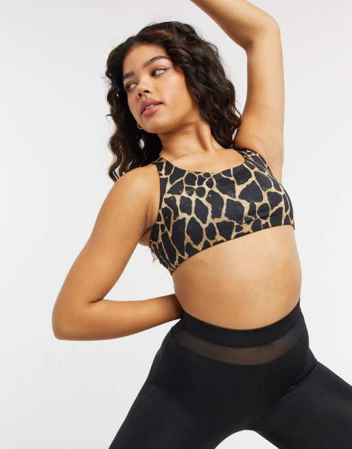 Onzie Chic medium support yoga sports bra in black giraffe