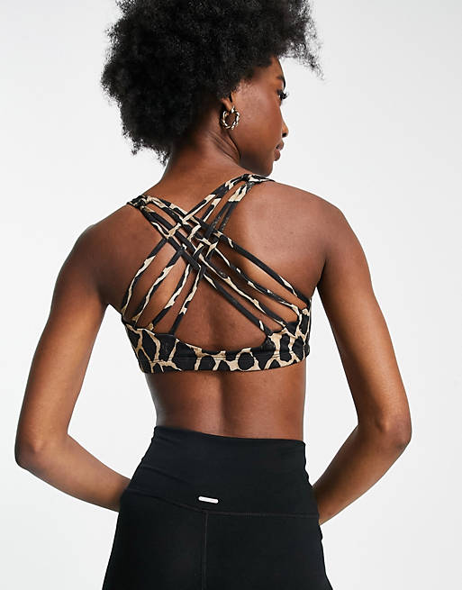 Women Onzie Chic medium support yoga sports bra in black giraffe 