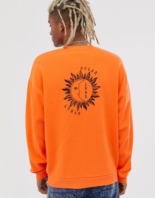 фото Оранжевый oversize-свитшот с принтом солнца и полумесяца asos design