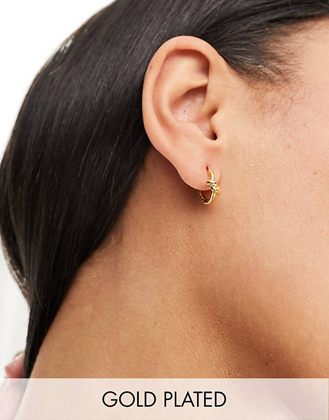 Orelia - 18k gold plated knot huggie hoop earrings