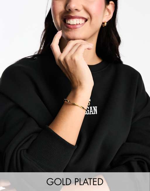  Orelia - Bracciale rigido placcato oro 18 k con design a forma di nastro attorcigliato 