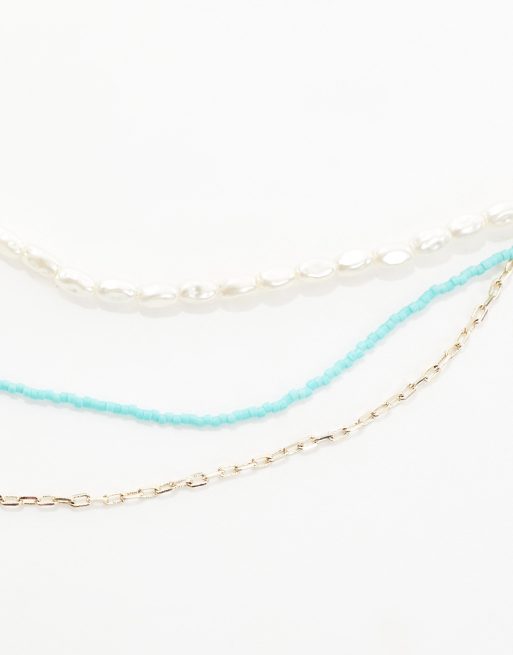 Orelia - Collana 3 fili con perle, perline turchesi e placcata oro, 2 di 4