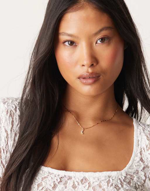 Orelia - Collier en plaqué or 18 carats avec charm lune à cristaux baguette