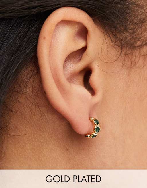 Orelia gold plated emerald tennis huggie hoops in gold 