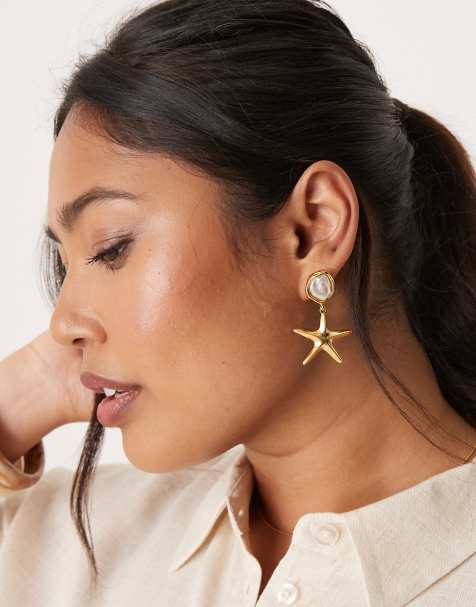 Orelia gold plated stud and starfish drop earrings in pale gold - view 1