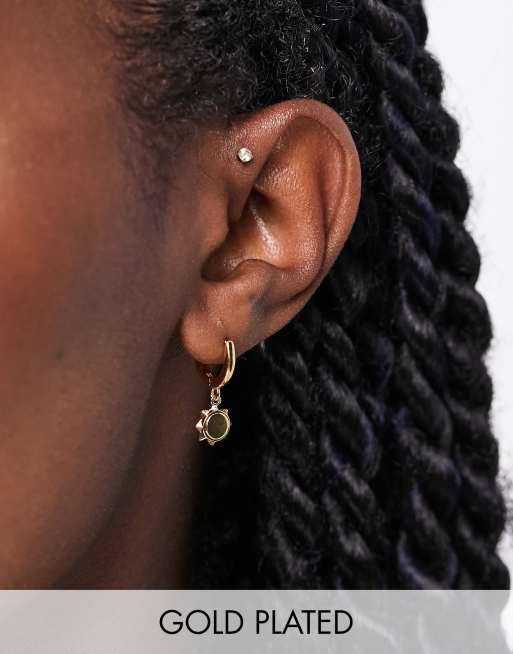Orelia huggie hoop earrings with sun charms in gold plate