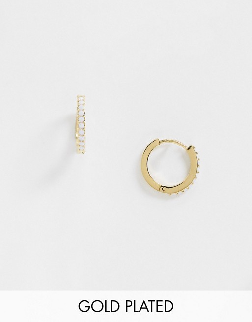 Orelia huggie hoop earrings with white crystals in gold plate