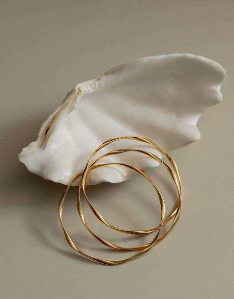 Orelia - Set van 3 vergulde in elkaar grijpende lint-armbanden van 18kt - view 1
