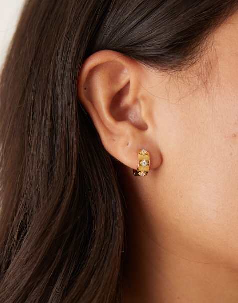 Orelia starburst metal huggie hoop earrings in gold plated - view 1