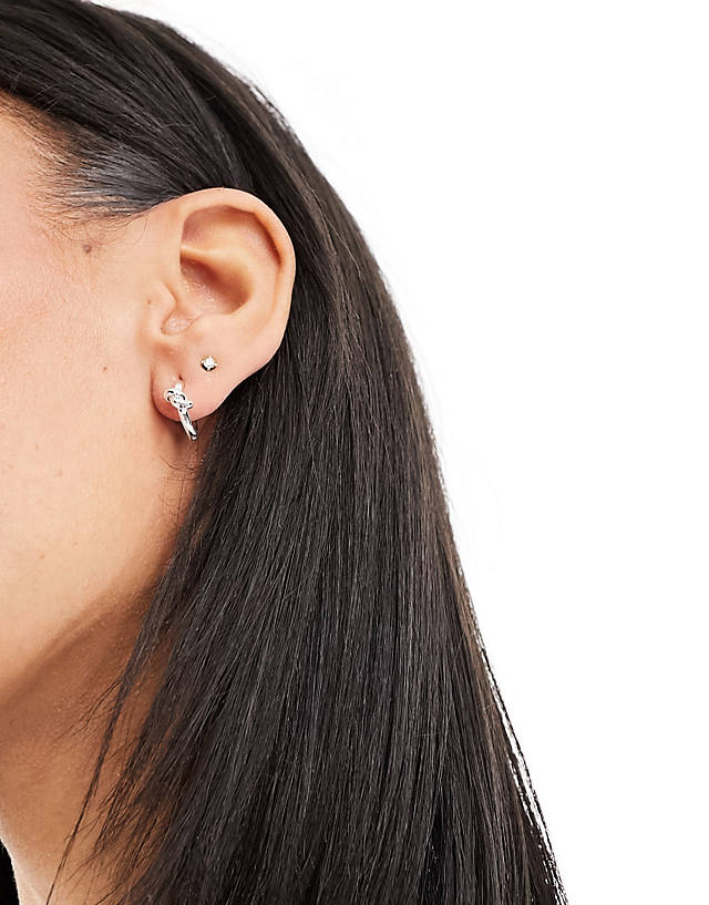 Orelia - sterling silver knot huggie hoop earrings