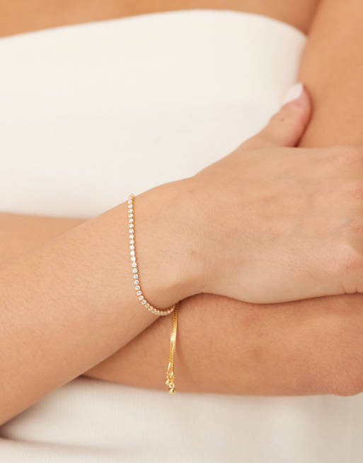 Orelia – Zartes Tennisarmband mit 18 Karat Vergoldung, Kristallsteinen und Schiebeverschluss