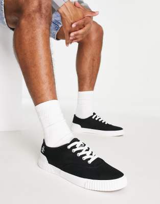 Original Penguin lace up plimsolls in black