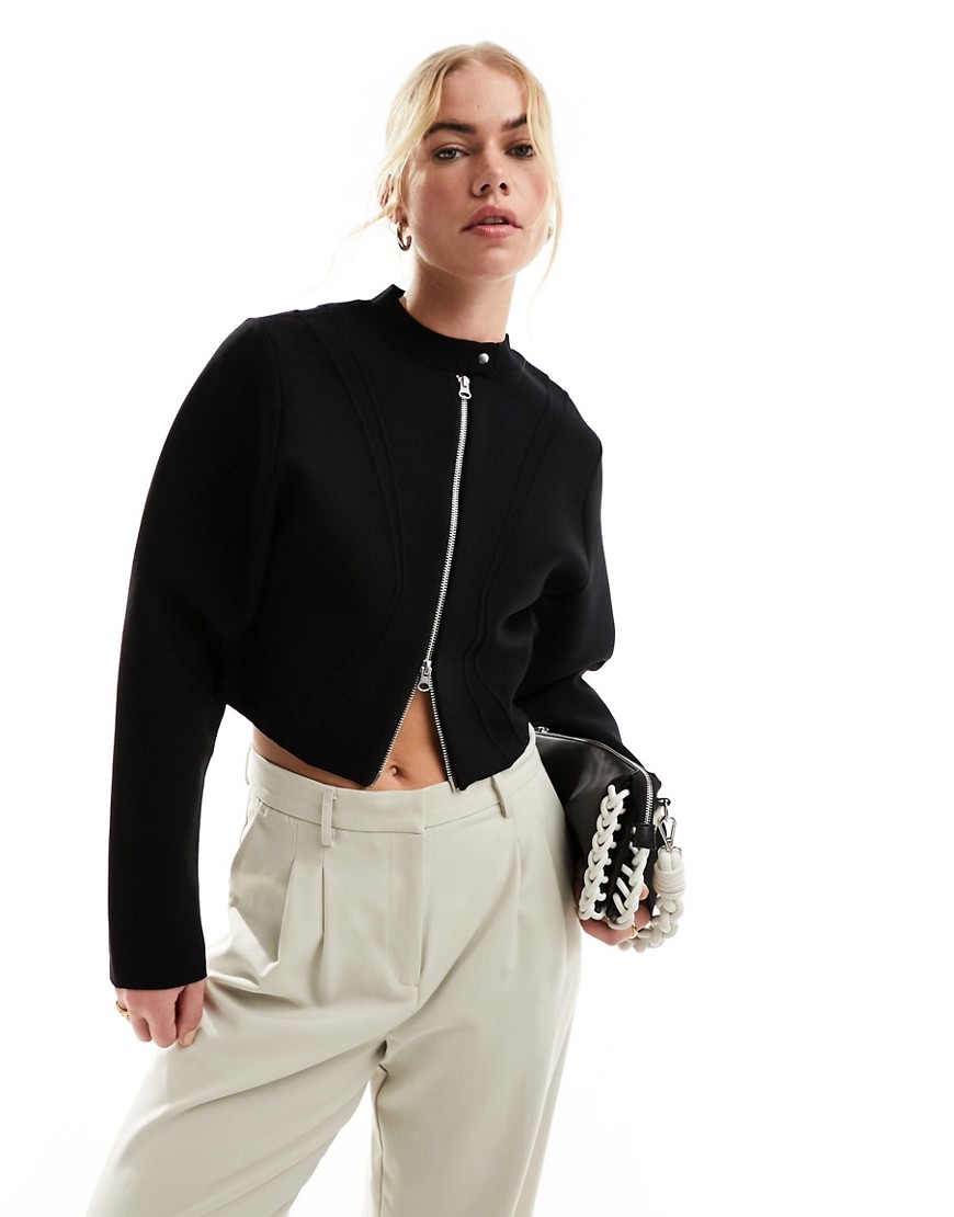 & Other Stories compact knitted jacket with zip front and panelled sculptural sleeves in black