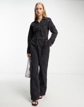 Parisian faux leather belted long sleeve jumpsuit in black