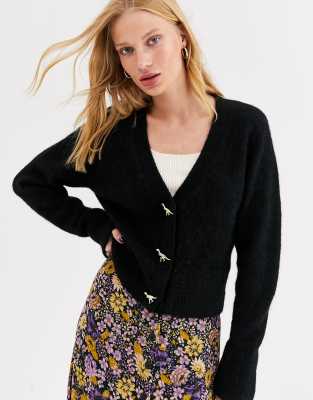 black cardigan with dinosaur buttons