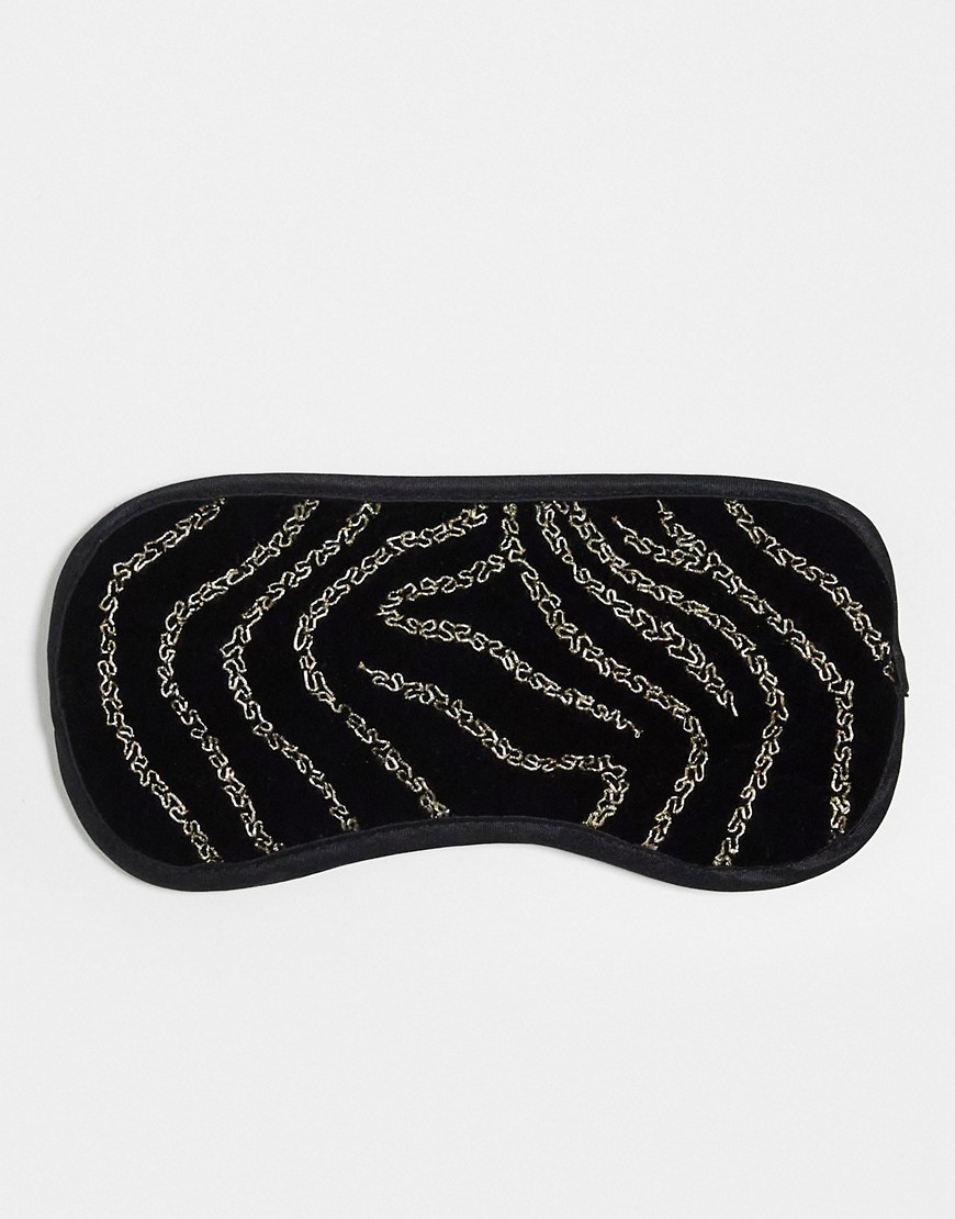 & Other Stories eyemask in black and gold