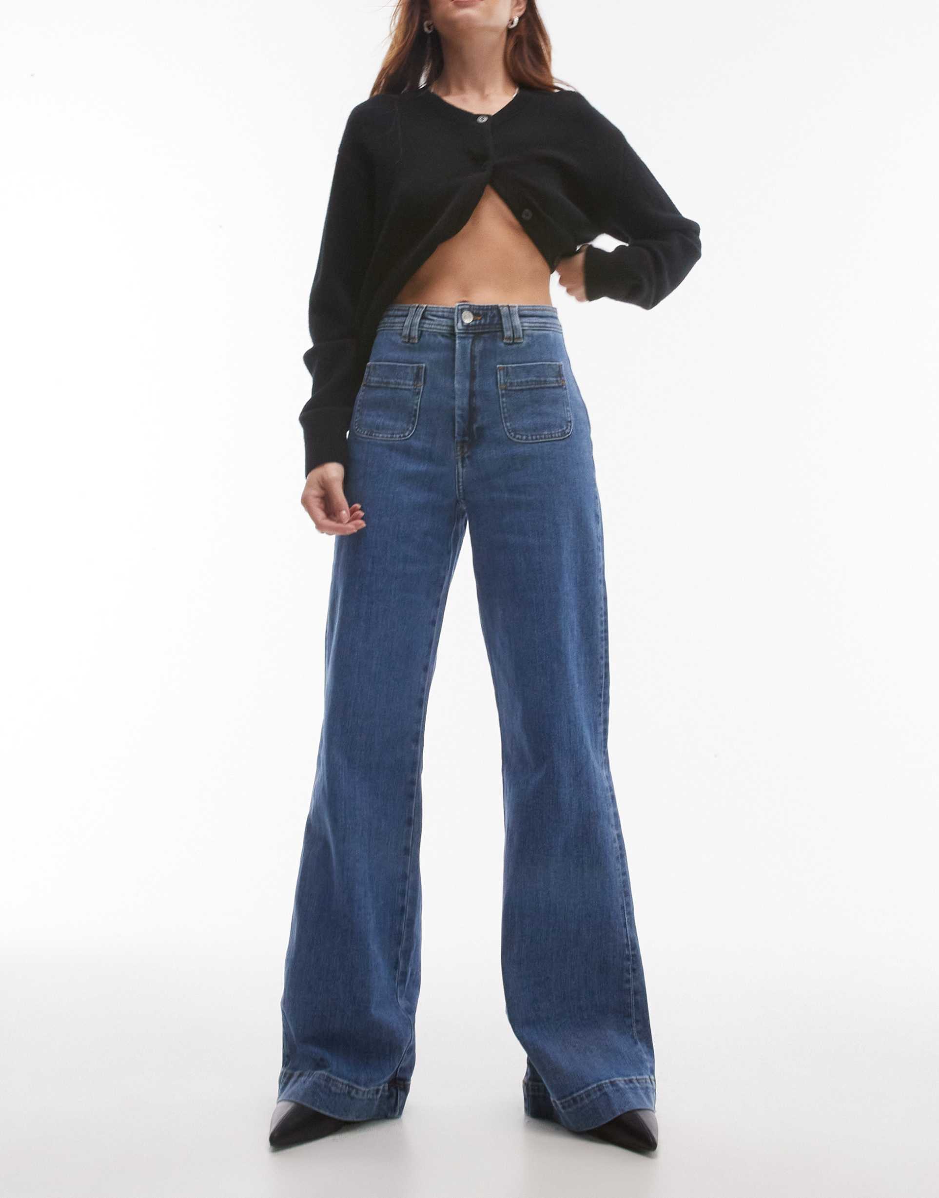 & other stories high rise flared jeans with patch pockets in mid blue wash