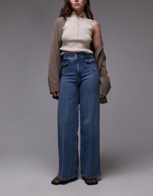 
Other Stories high rise wide leg jeans with double button waistband and pocket detail in mid wash blue