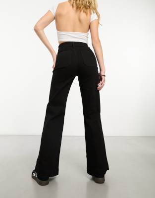 & Other Stories High Waist Flared Leg Jeans With Button Front Detail And Patch Pockets