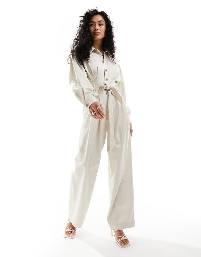 & Other Stories - long sleeve jumpsuit with button front and tie waist in light beige