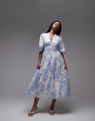 & Other Stories - Midaxikleid in Blau geblümt mit voluminösen Ärmeln und gesmoktem Oberteil