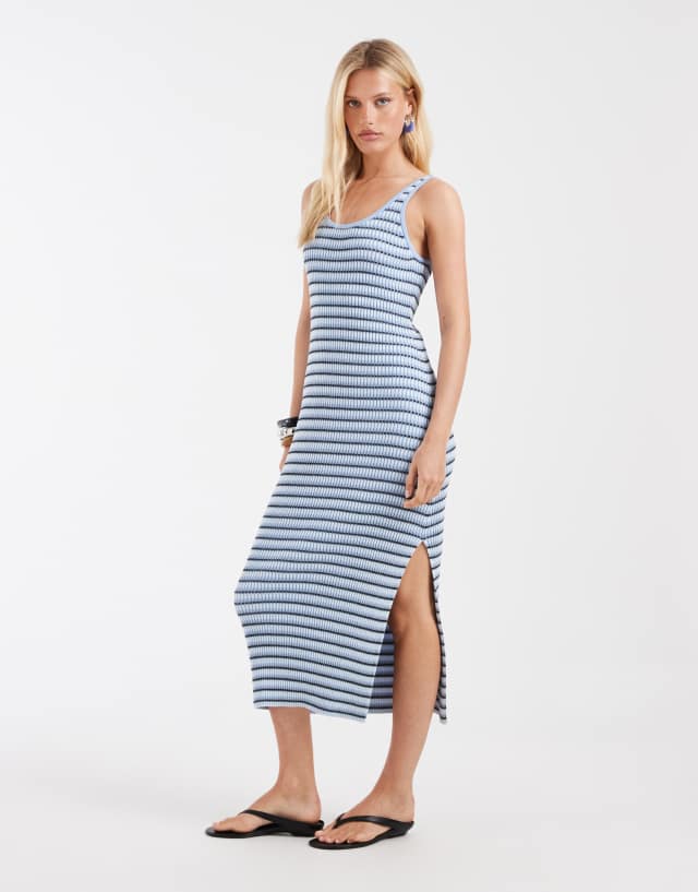 blue and white striped knit dress & Other Stories ribbed maxi in Navy Color:Cloudy _okendo:syndication_key:CL136700002 Cayetana Teal Fringe Maxi Featuring a fitted short