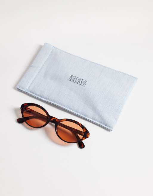 & Other Stories slim oval sunglasses in dark red tortoise with linen pouch case, 3 of 3