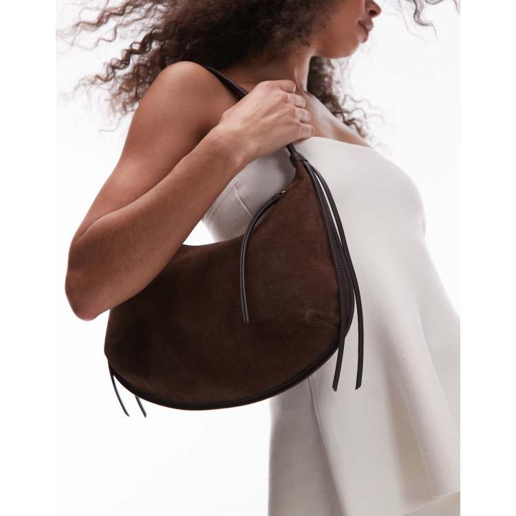 asos suede mini backpack with fringing One Arm Back Bag It features a magnetic closure ASOS DESIGN suede fringe crossbody