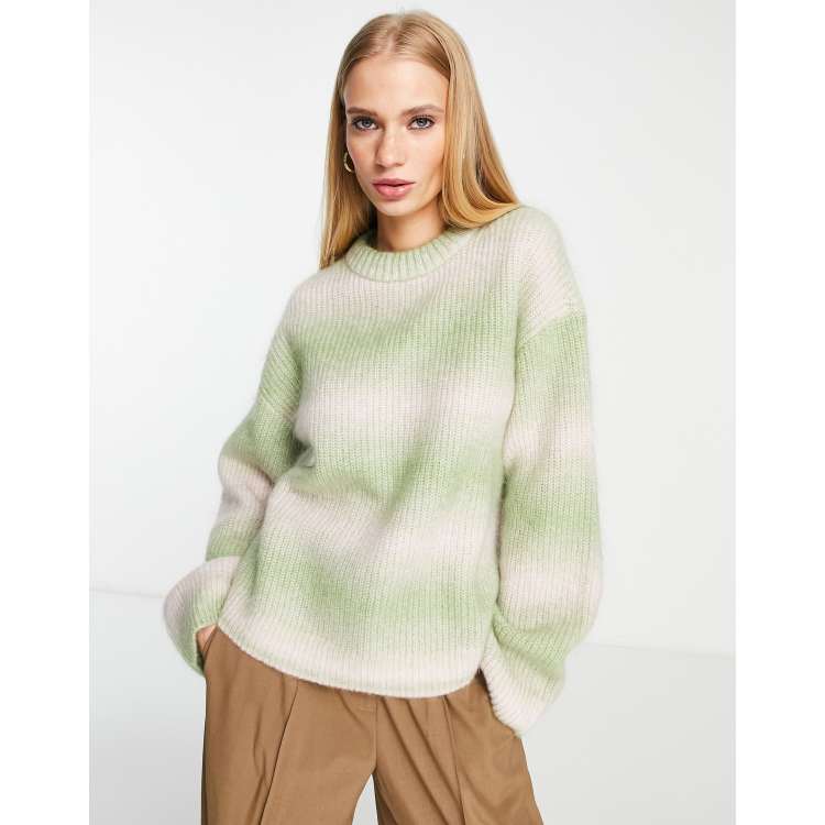 White and 2024 green sweater