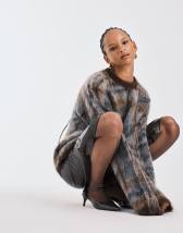 ARKET wool rich mini skirt with front pockets in orange